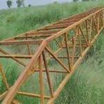An example of community cooperation: 70 families came together to build a bridge over the river, making the commute easier for schoolchildren.